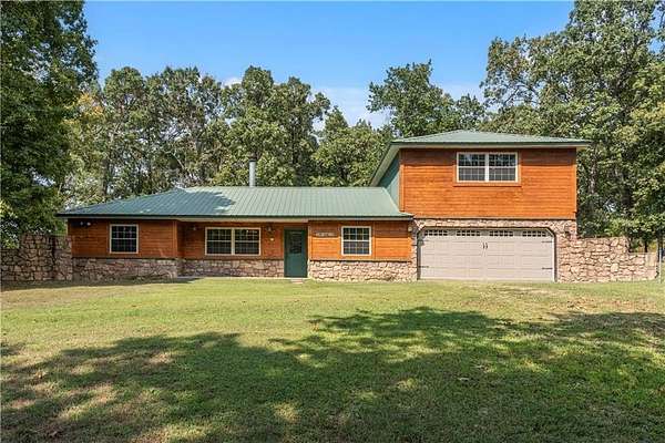 5 Acres of Residential Land with Home for Sale in Gravette, Arkansas