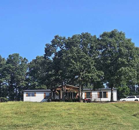 46.2 Acres of Land with Home for Sale in Umpire, Arkansas