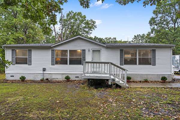 5 Acres of Residential Land with Home for Sale in Pleasant Hope, Missouri