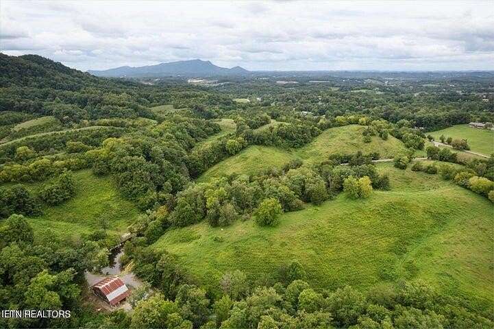 39.7 Acres of Agricultural Land with Home for Sale in Sevierville, Tennessee