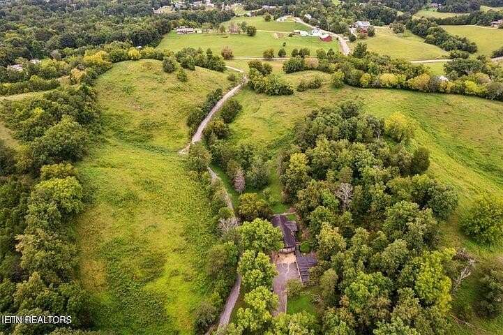 39.7 Acres of Agricultural Land with Home for Sale in Sevierville, Tennessee