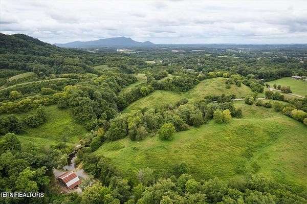 39.7 Acres of Agricultural Land with Home for Sale in Sevierville, Tennessee