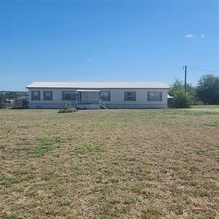 2 Acres of Residential Land with Home for Sale in Rhome, Texas
