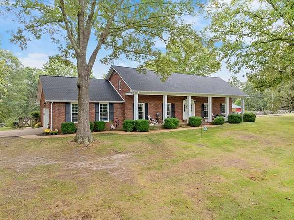 92.2 Acres of Land with Home for Sale in Camden, Tennessee