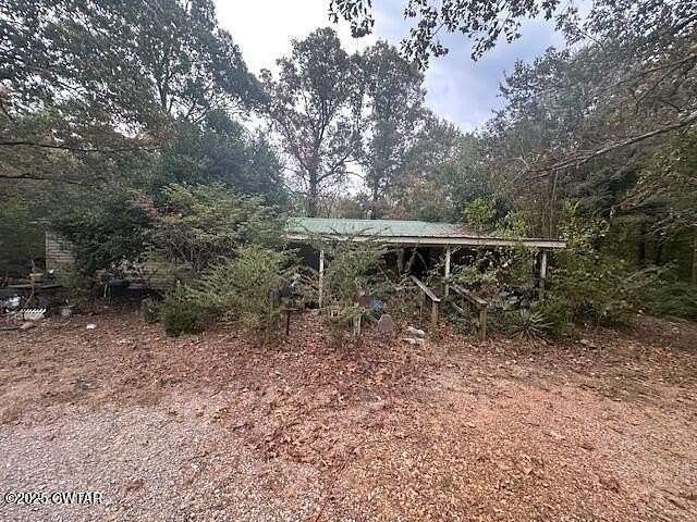 1.57 Acres of Residential Land with Home for Auction in Selmer, Tennessee