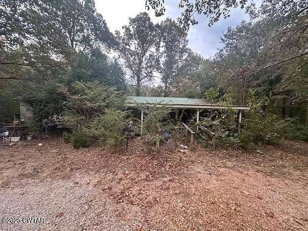 1.57 Acres of Residential Land with Home for Auction in Selmer, Tennessee