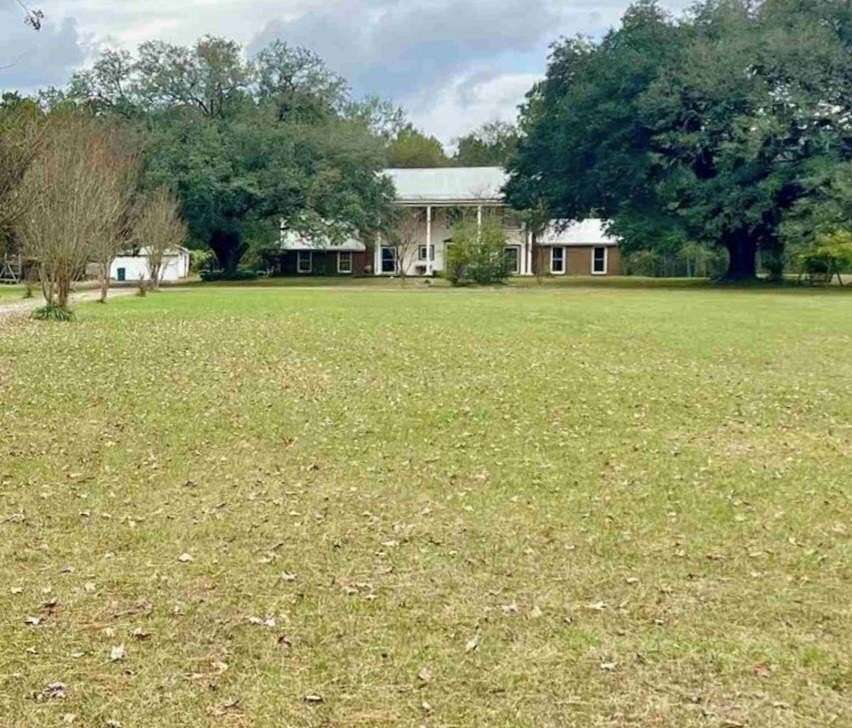 5 Acres of Residential Land with Home for Sale in Carthage, Texas