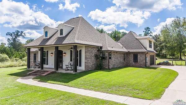 12.5 Acres of Recreational Land with Home for Sale in Waskom, Texas