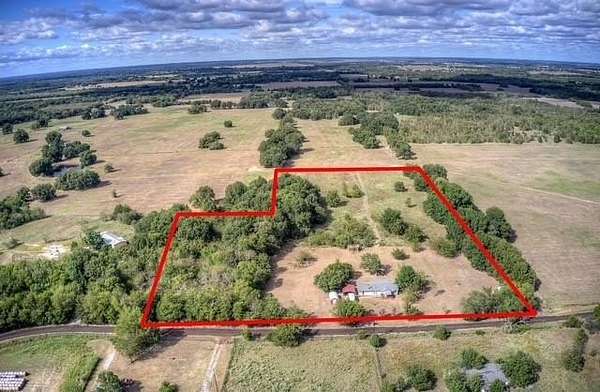 10.4 Acres of Land with Home for Sale in Commerce, Texas