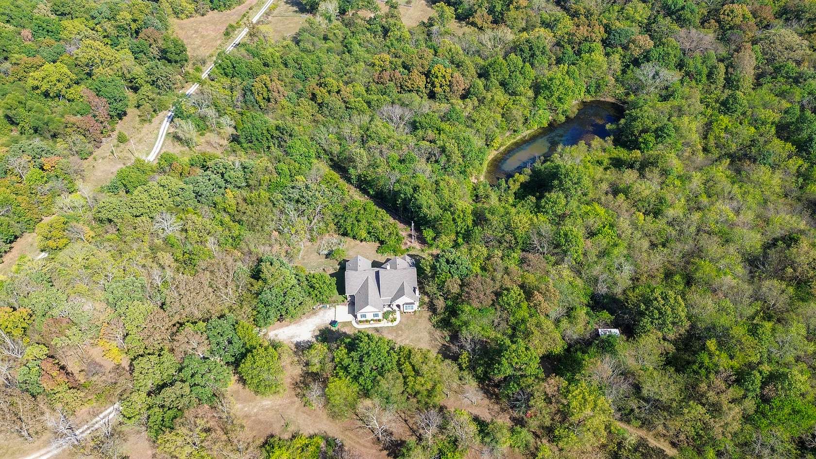 61.9 Acres of Recreational Land with Home for Sale in Butler, Missouri