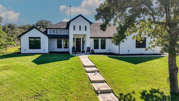 5 Acres of Residential Land with Home for Sale in Poolville, Texas