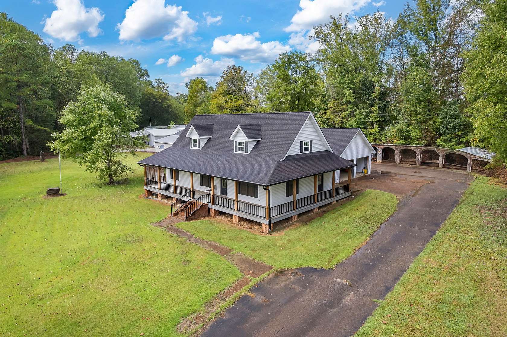 4.54 Acres of Residential Land with Home for Sale in Scotts Hill, Tennessee