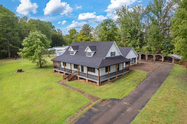 4.54 Acres of Residential Land with Home for Sale in Scotts Hill, Tennessee