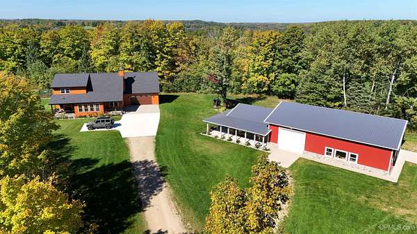 230 Acres of Recreational Land with Home for Sale in Eben Junction, Michigan