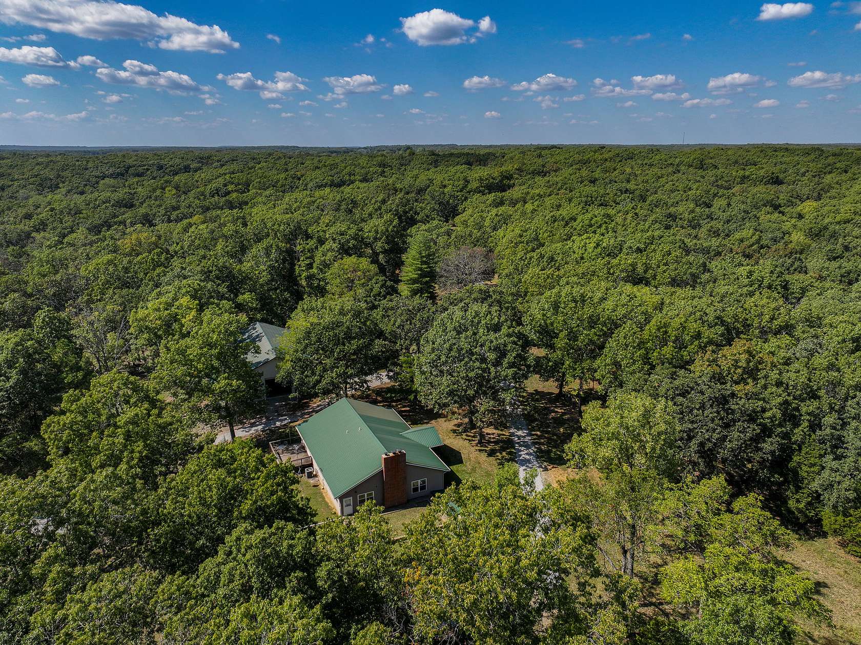 109 Acres of Recreational Land with Home for Sale in Collins, Missouri