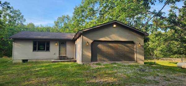 14 Acres of Recreational Land with Home for Sale in Indian River, Michigan