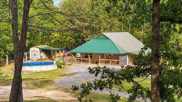 5.75 Acres of Land with Home for Sale in Oldfort, Tennessee