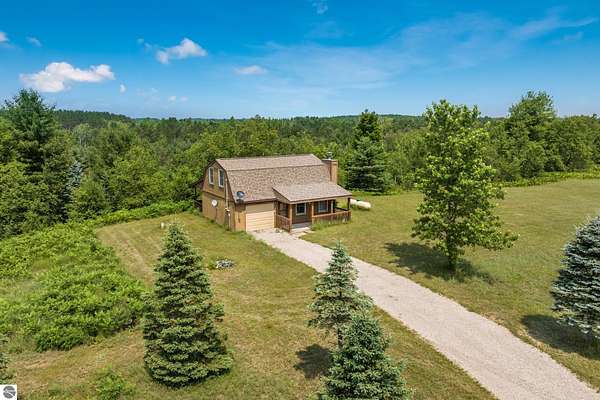 13.2 Acres of Recreational Land with Home for Sale in Mancelona, Michigan