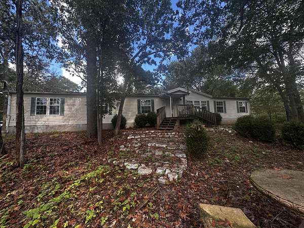 9.29 Acres of Residential Land with Home for Sale in Grovespring, Missouri