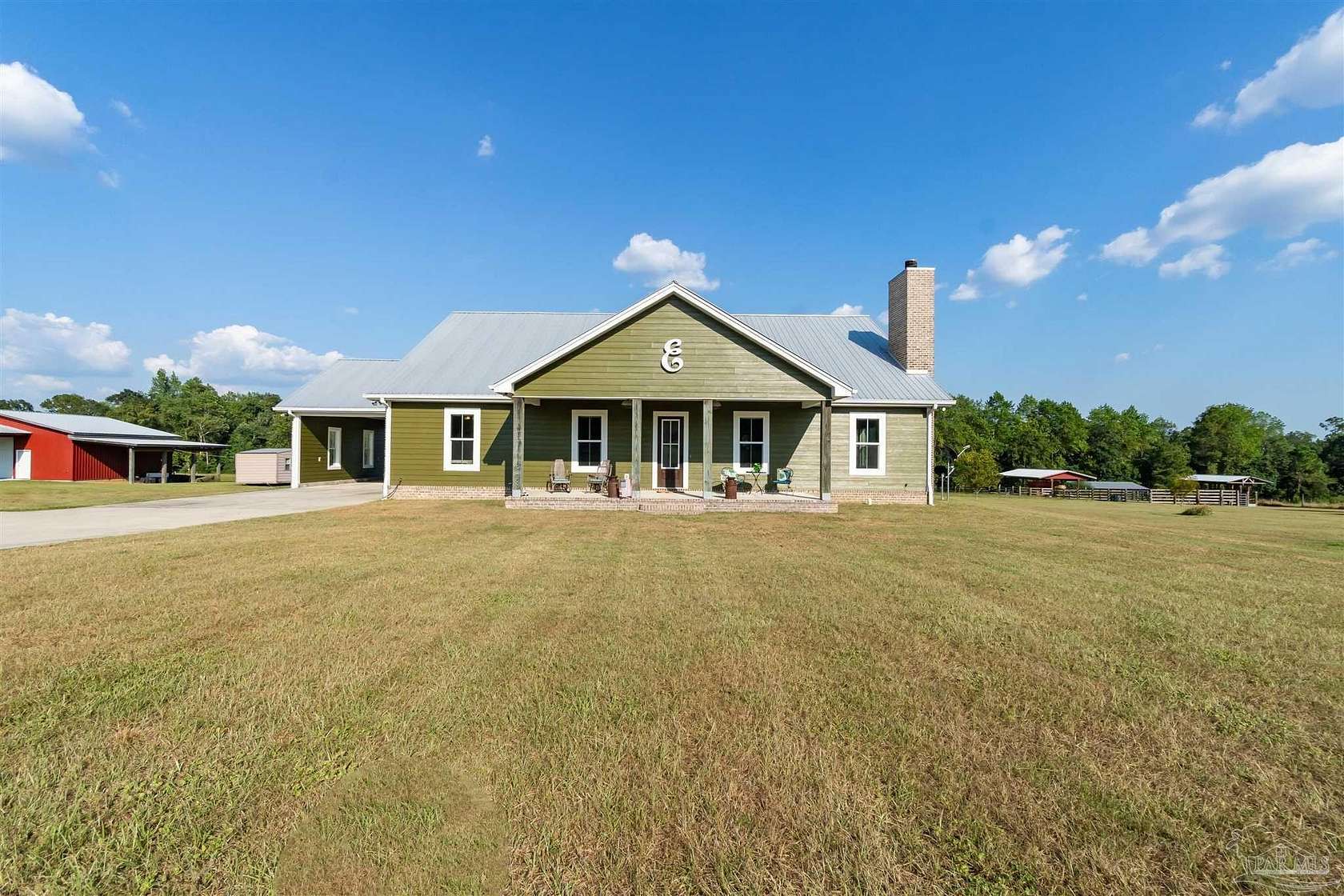 20.4 Acres of Agricultural Land with Home for Sale in Molino, Florida