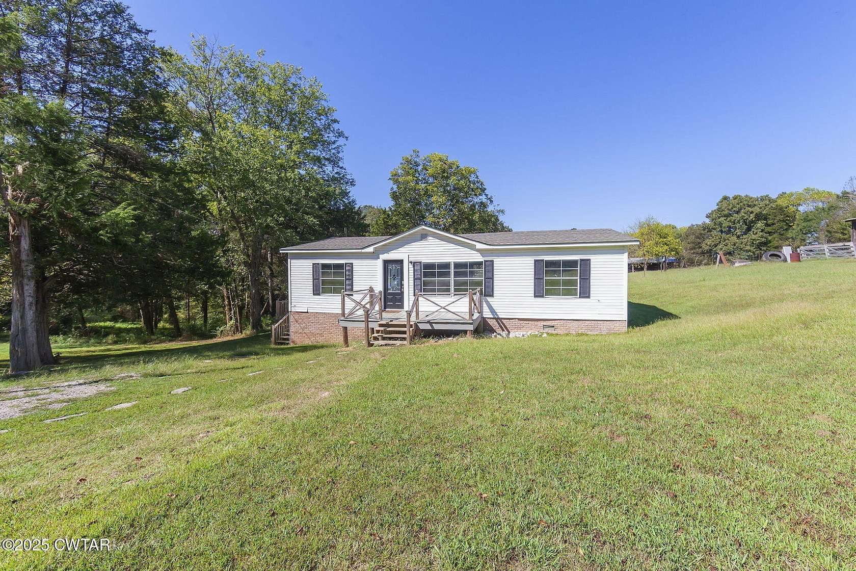 1.69 Acres of Residential Land with Home for Sale in Beech Bluff, Tennessee