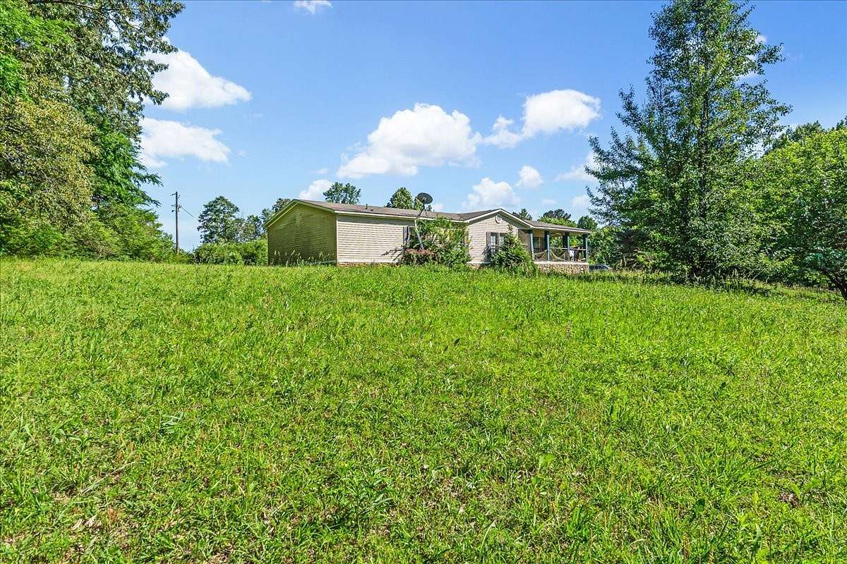 4.53 Acres of Residential Land with Home for Sale in Luray, Tennessee