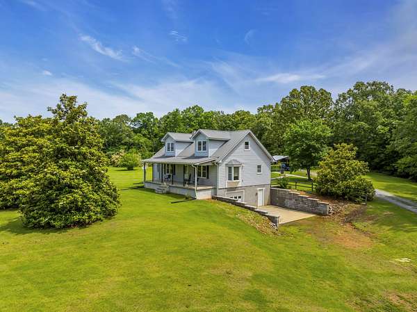 5.88 Acres of Residential Land with Home for Sale in Hurricane Mills, Tennessee
