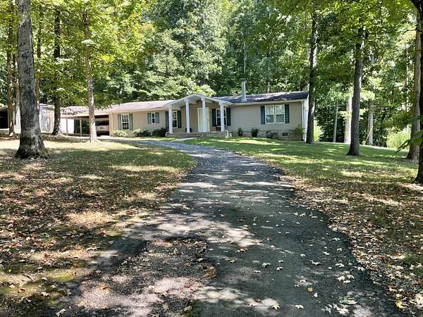 9.38 Acres of Residential Land with Home for Auction in Morristown, Tennessee