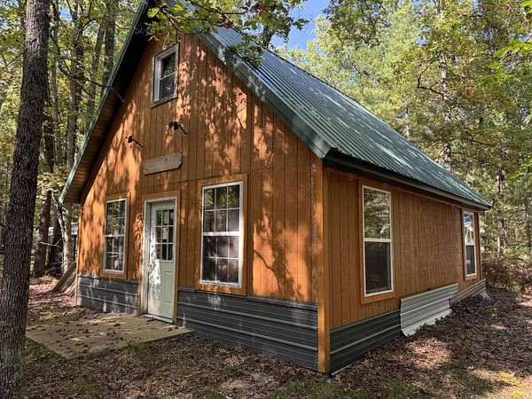 19.5 Acres of Recreational Land with Home for Sale in Irons, Michigan