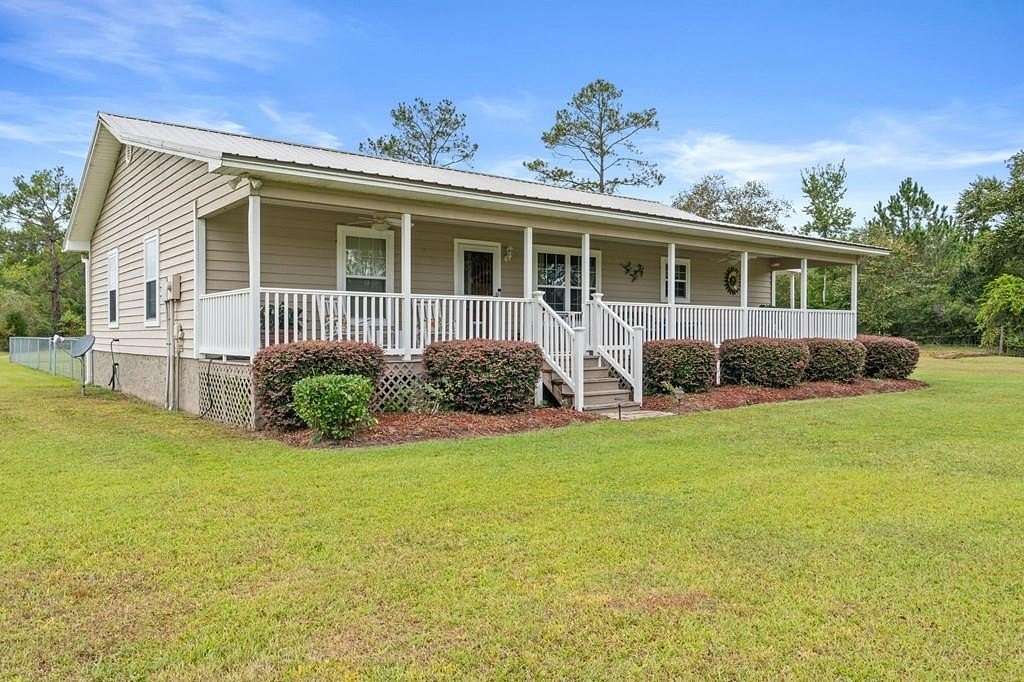 9.2 Acres of Land with Home for Sale in Wewahitchka, Florida