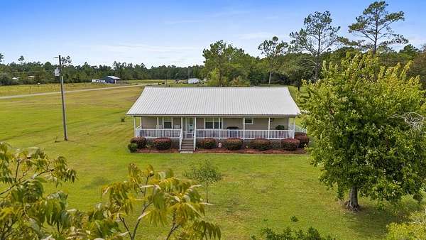9.2 Acres of Land with Home for Sale in Wewahitchka, Florida