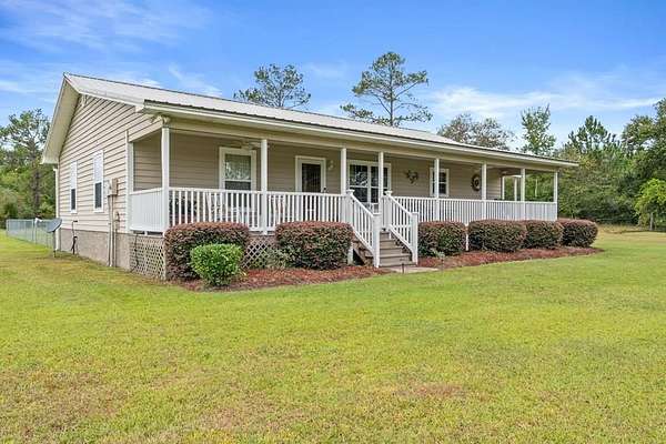 9.2 Acres of Land with Home for Sale in Wewahitchka, Florida