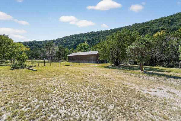 5 Acres of Residential Land with Home for Sale in Leakey, Texas