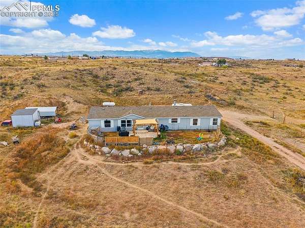 7.6 Acres of Residential Land with Home for Sale in Fountain, Colorado