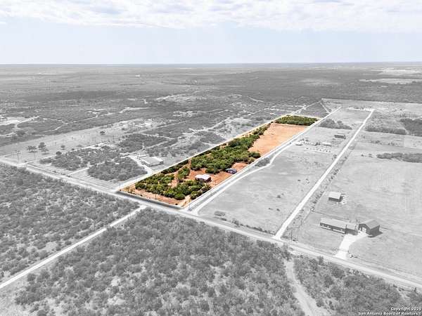 10 Acres of Land with Home for Sale in Devine, Texas