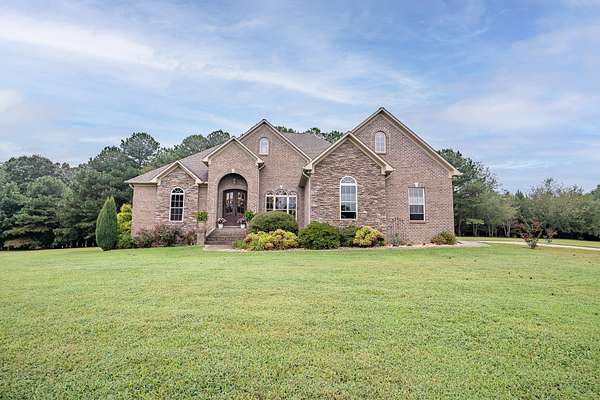 3.2 Acres of Residential Land with Home for Sale in Lawrenceburg, Tennessee