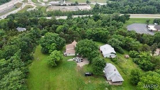 9.38 Acres of Residential Land with Home for Sale in Barnhart, Missouri