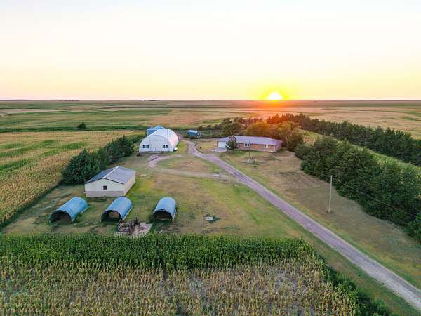 82 Acres of Agricultural Land with Home for Sale in Oakley, Kansas