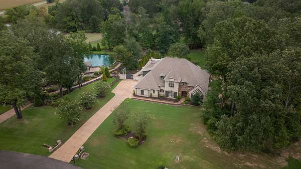 2.3 Acres of Residential Land with Home for Sale in Eads, Tennessee