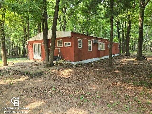 80 Acres of Land with Home for Sale in Emmett, Michigan