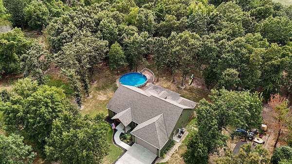 9.39 Acres of Land with Home for Sale in Stotts City, Missouri