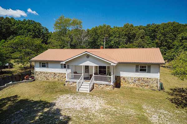4.1 Acres of Residential Land with Home for Auction in Baxter, Tennessee