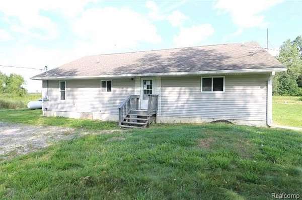 5 Acres of Residential Land with Home for Sale in Lynn Township, Michigan