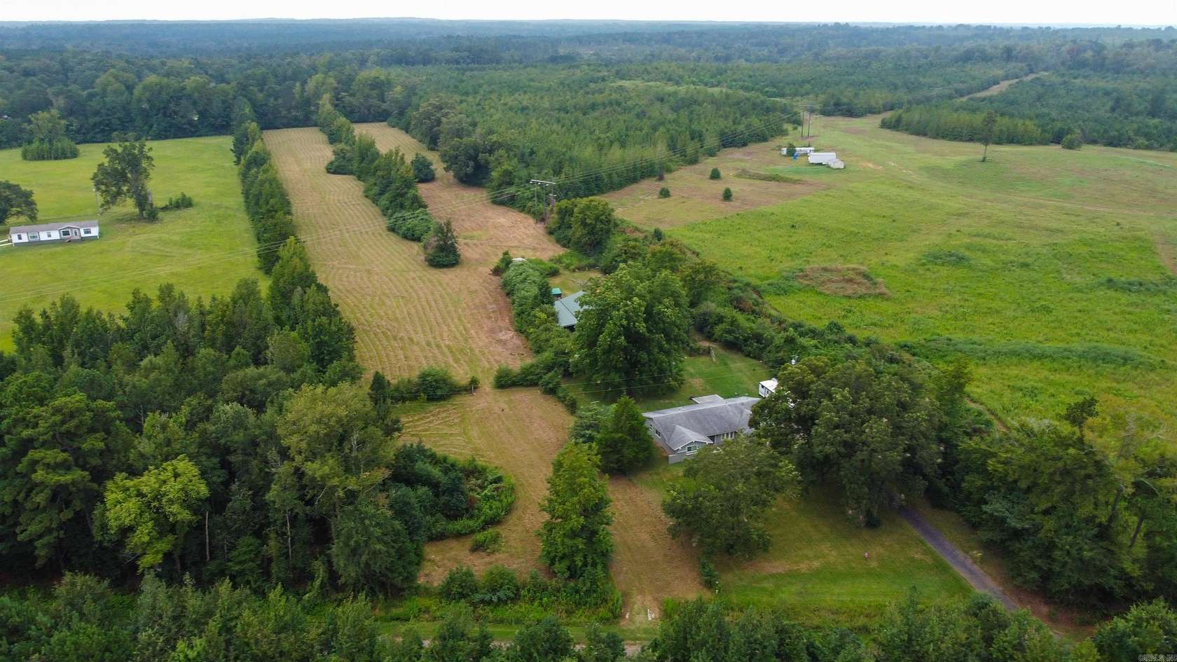 7.7 Acres of Residential Land with Home for Sale in Atlanta, Texas