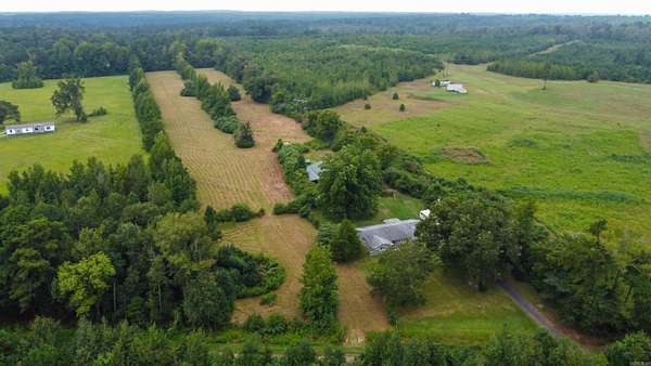 7.7 Acres of Residential Land with Home for Sale in Atlanta, Texas