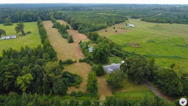 7.7 Acres of Land with Home for Sale in Atlanta, Texas