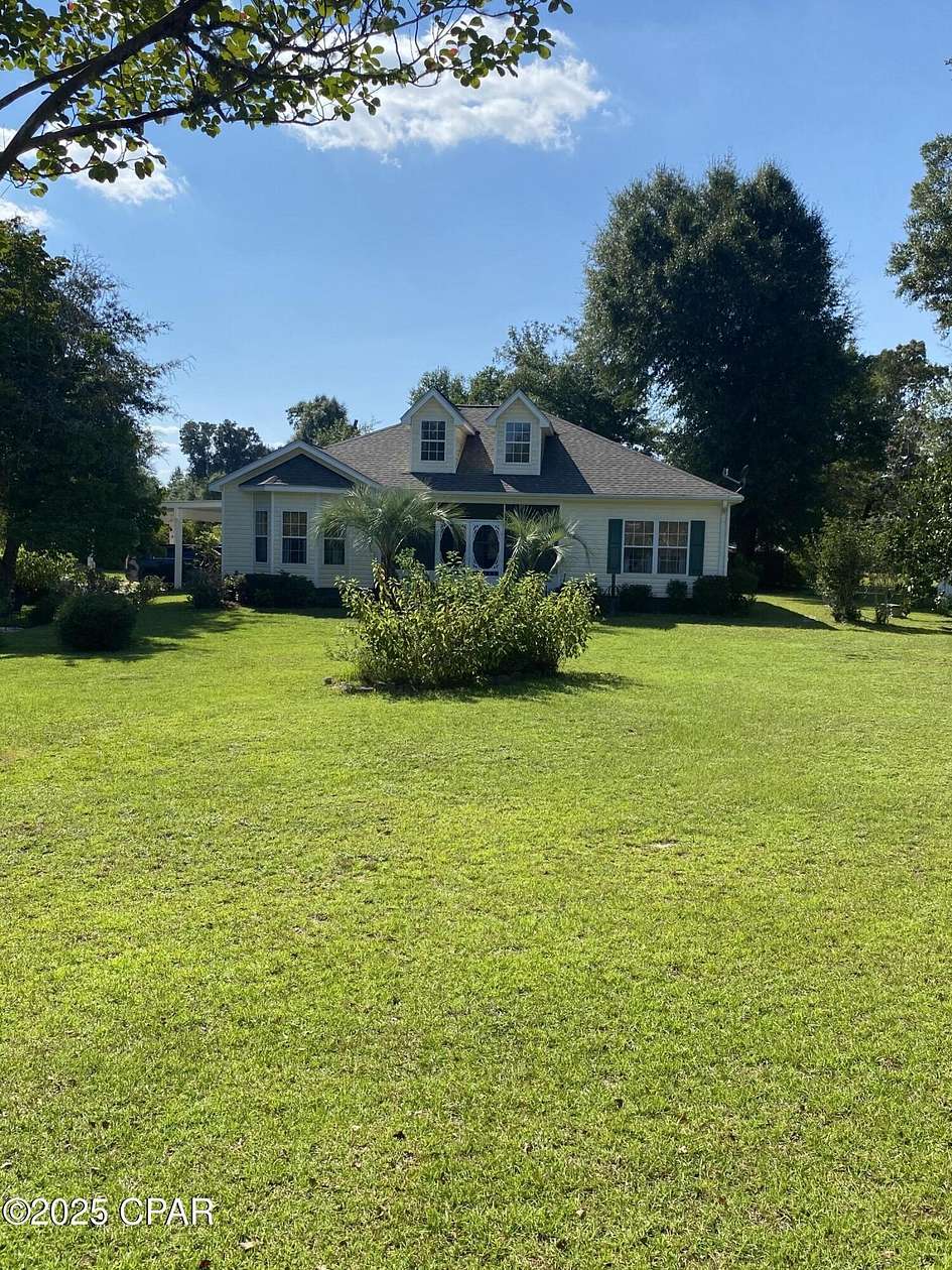 24.8 Acres of Land with Home for Sale in Altha, Florida