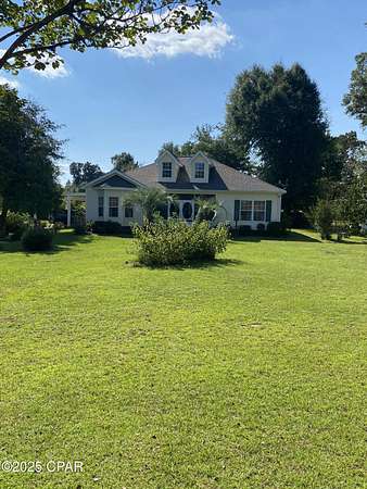 24.8 Acres of Land with Home for Sale in Altha, Florida