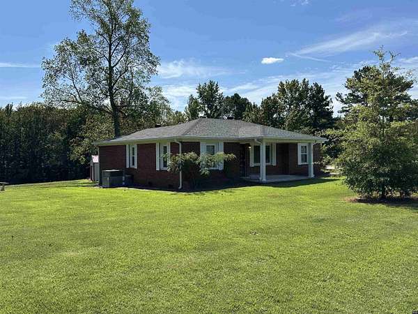 4.57 Acres of Residential Land with Home for Sale in Camden, Tennessee