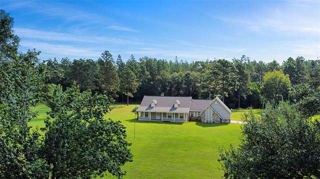 5.6 Acres of Residential Land with Home for Sale in Kentwood, Louisiana